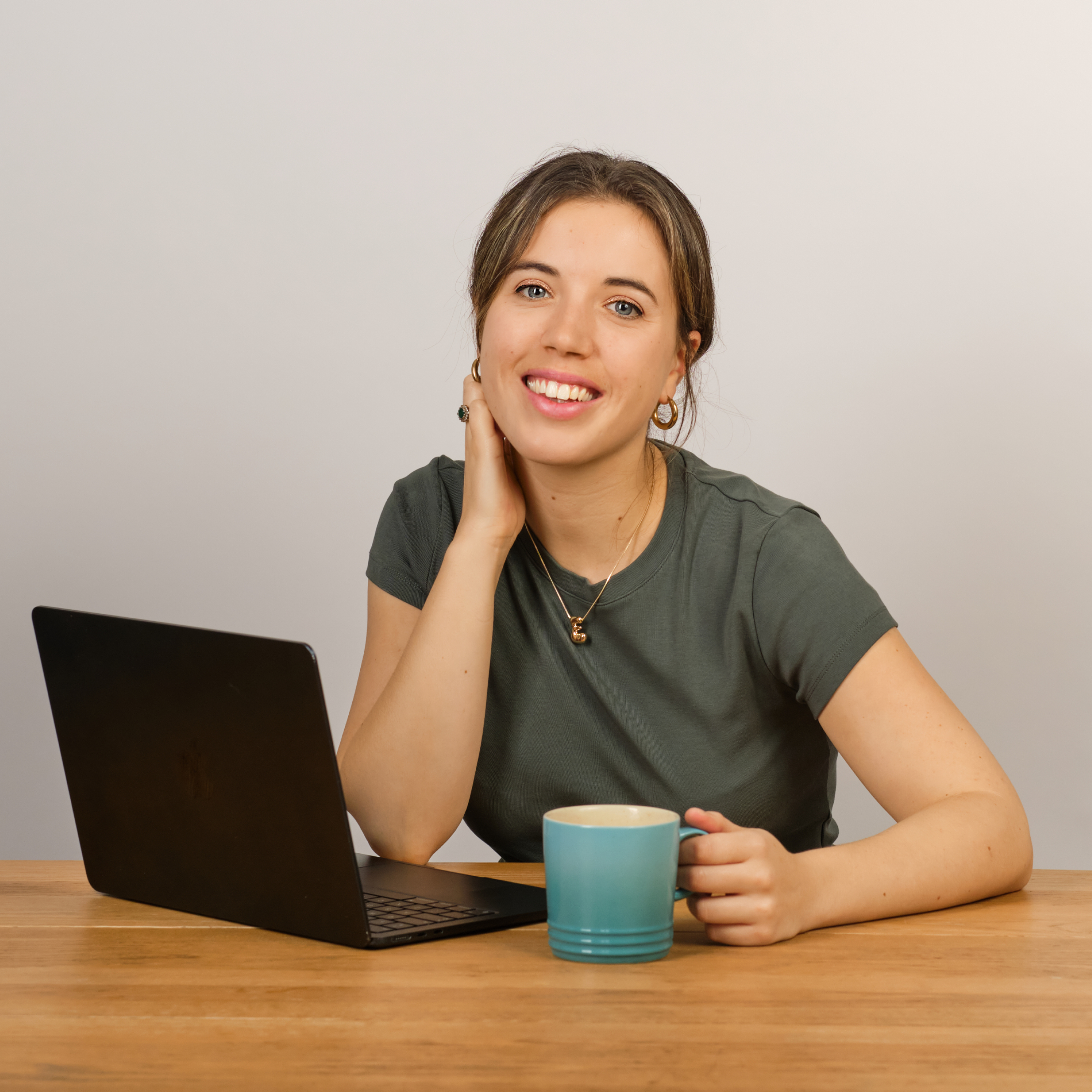 Emily at her desk with a laptop